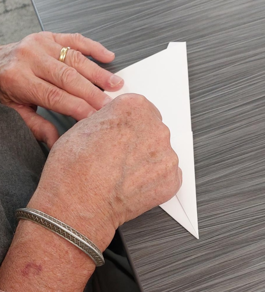 hands folding kites