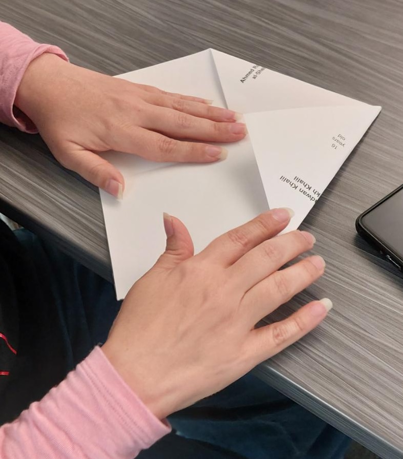 hands folding kites